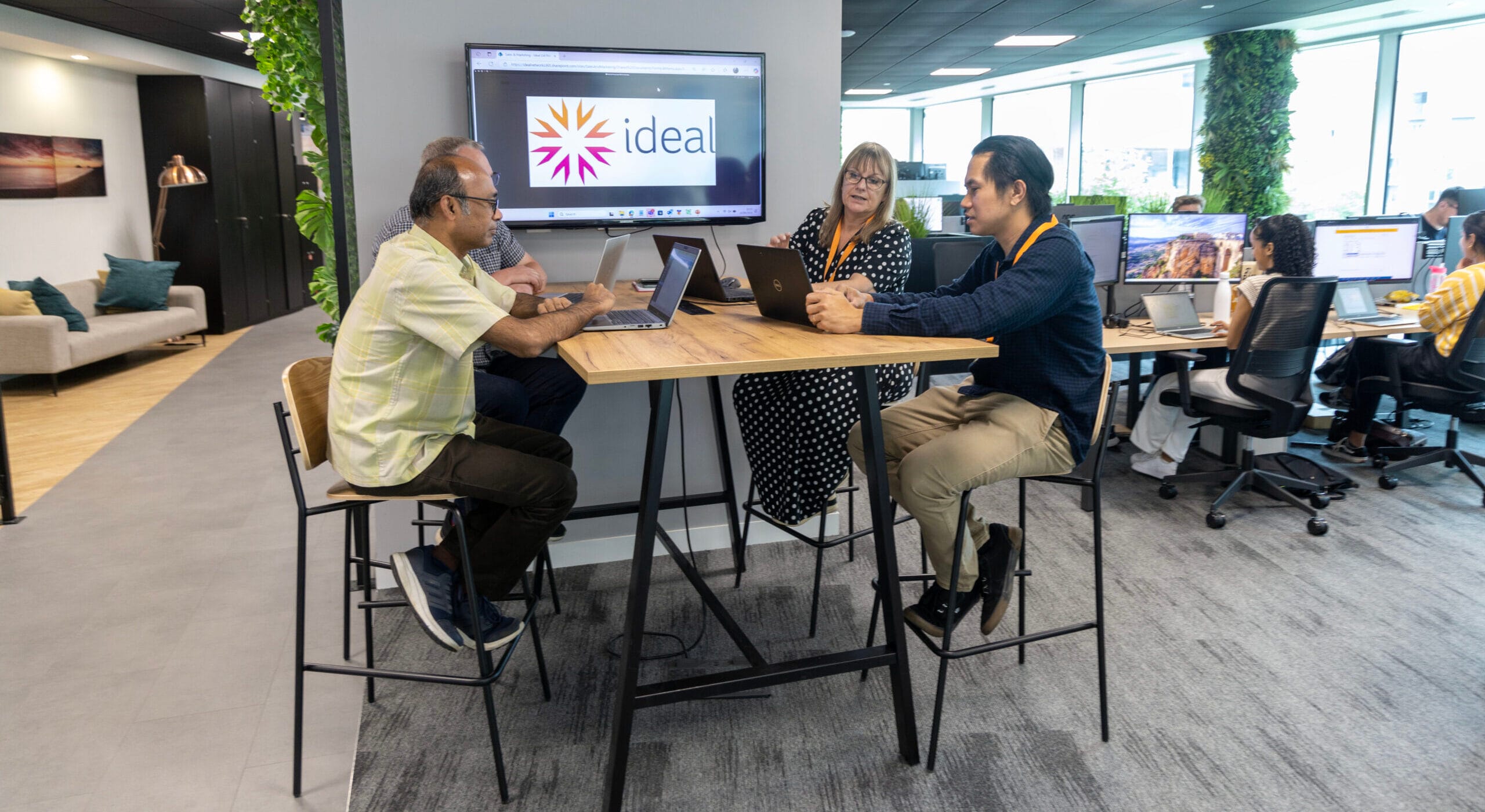People at a high table in a meeting