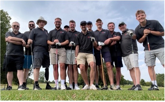 Some of the Ideal team with golf clubs, ready to enjoy the company golf day.