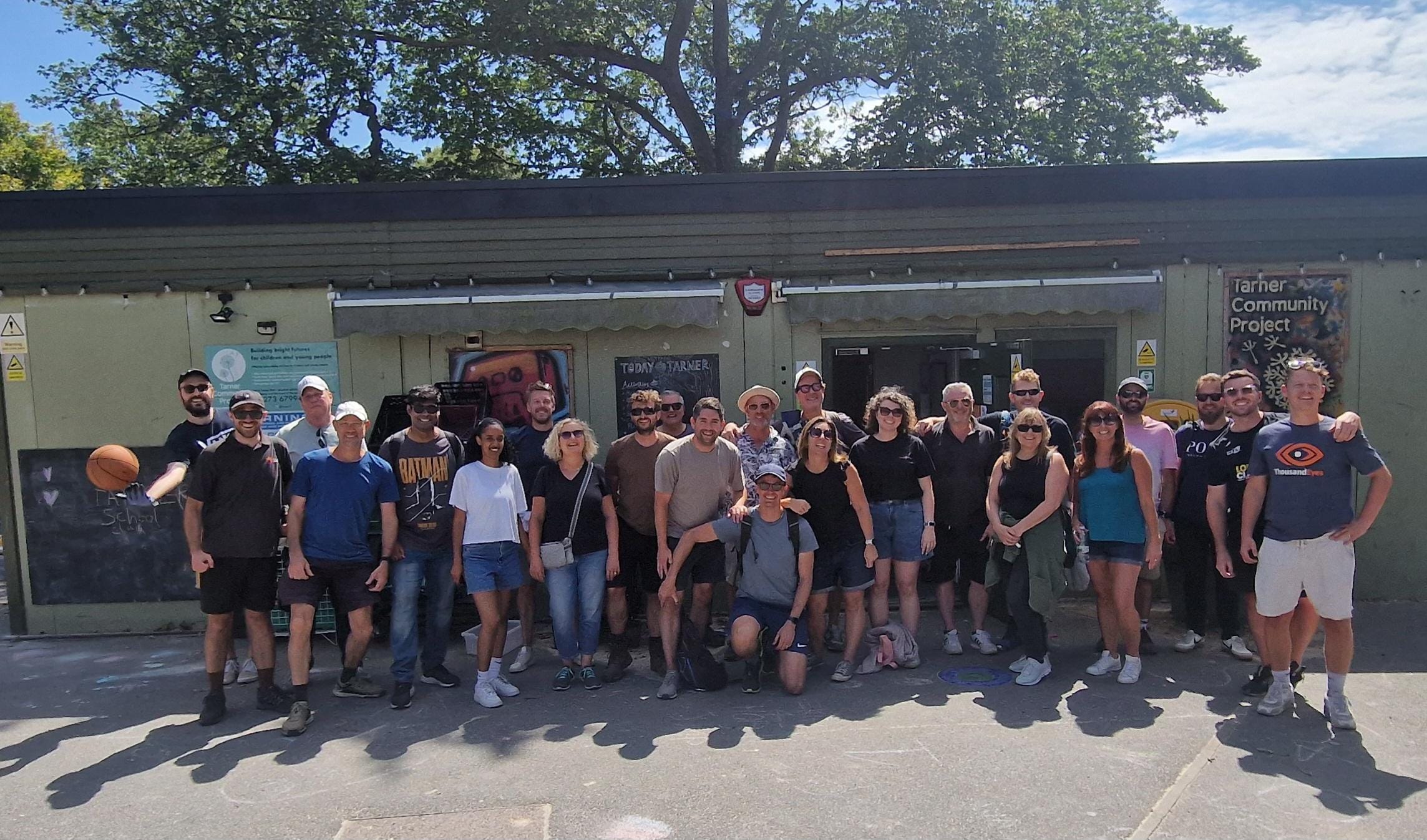 The Ideal team outside the Tarner building following a community action day.