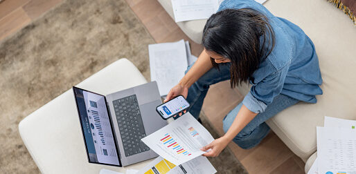 Thin crop of high angle view of an African American woman organizing her finances at home - financial planning concepts